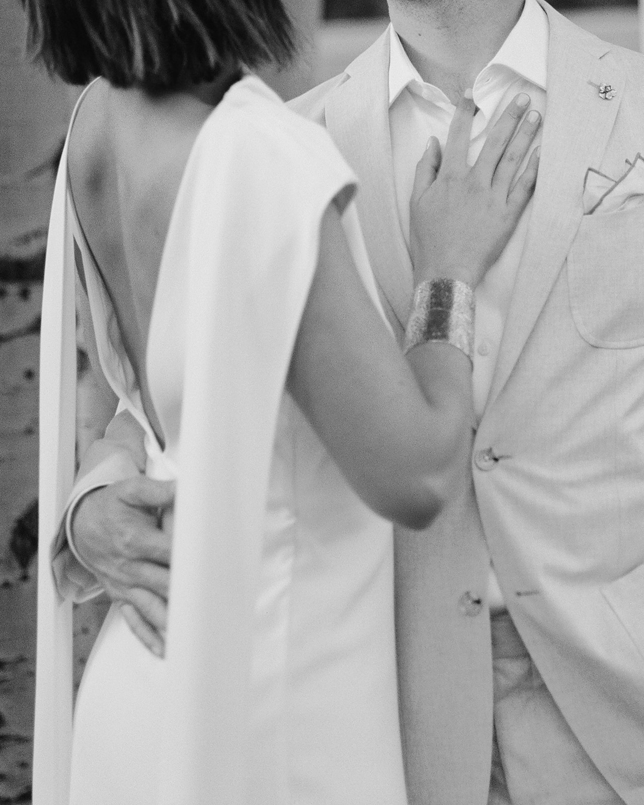 Bride's hand on groom's chest during an embrace. @colinandlakin https://www.colinandlakin.com/ 